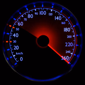 Speedometer with a glowing red needle at high speed
