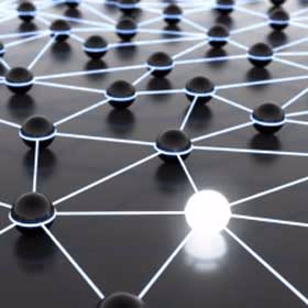 Network of black spheres connected by glowing lines, one sphere lit up