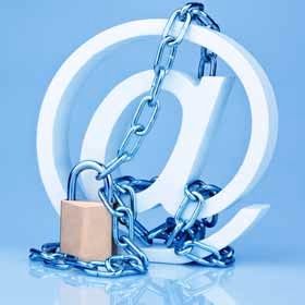 White @ sign wrapped in chains and closed with a padlock