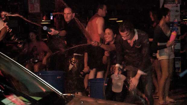 Songkran People Throwing Water At Car