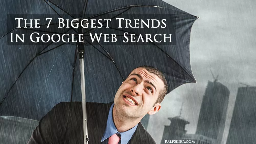 7-trends-google-web-search Business man in heavy rain.